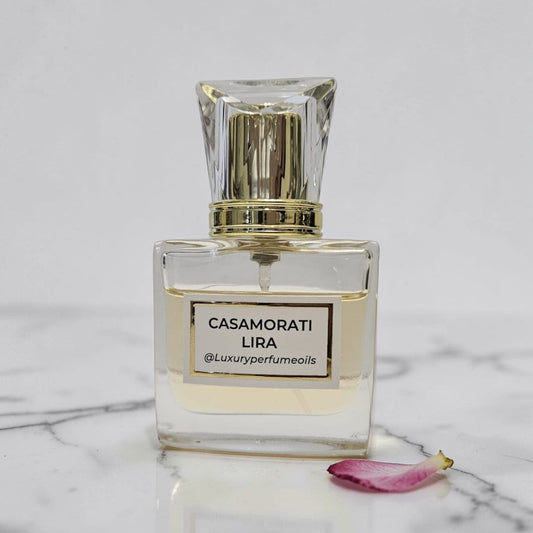 Our Version of Casamorati Lira 20ml alcohol-free perfume oil bottle with oriental floral fragrance featuring blood orange, bergamot, lavender, cinnamon, vanilla, caramel, and musk.