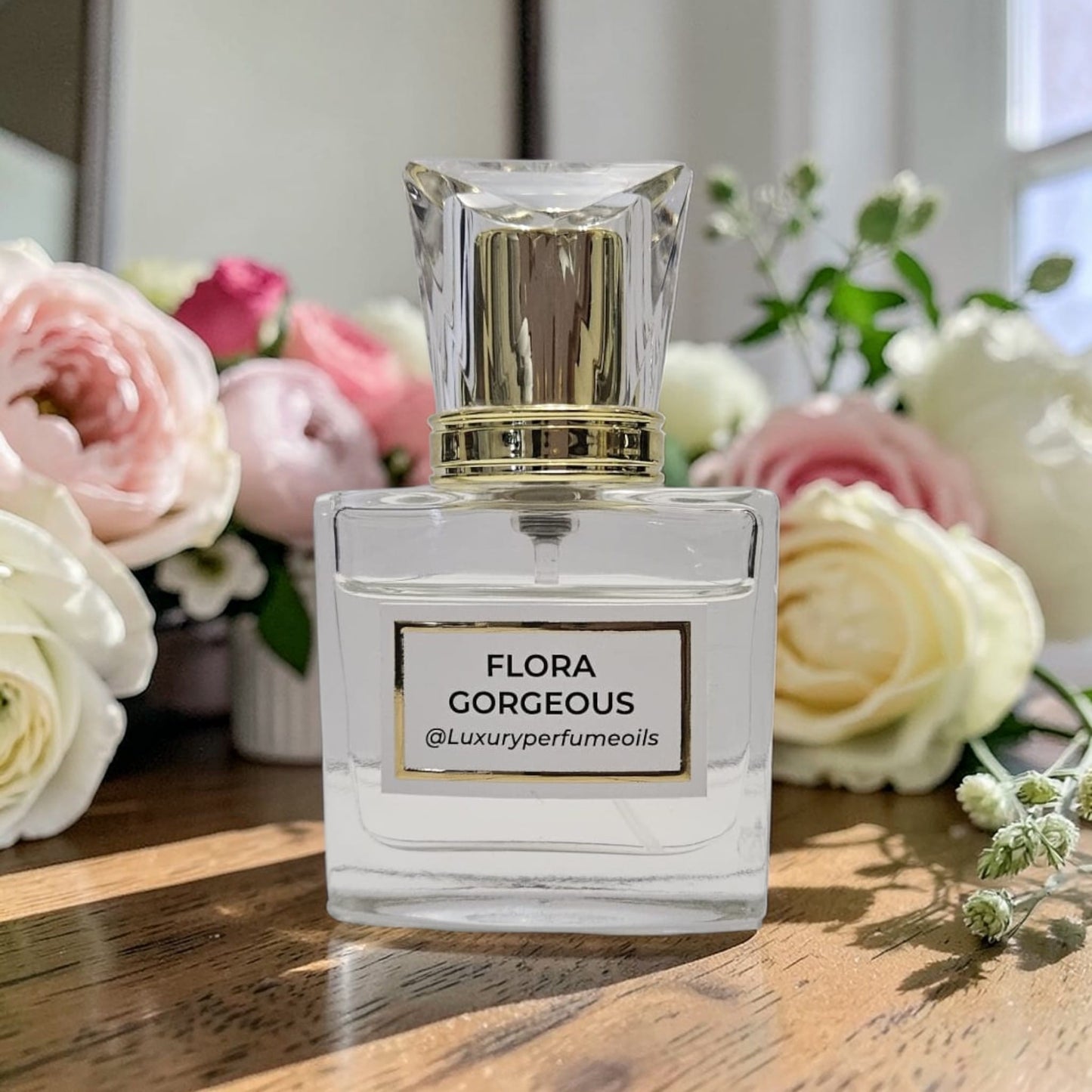 Our Version of Flora Gorgeous Gardenia 20ml alcohol-free perfume oil bottle with floral fragrance featuring pear blossom, red berries, Italian mandarin, gardenia, jasmine, frangipani, brown sugar, and patchouli.