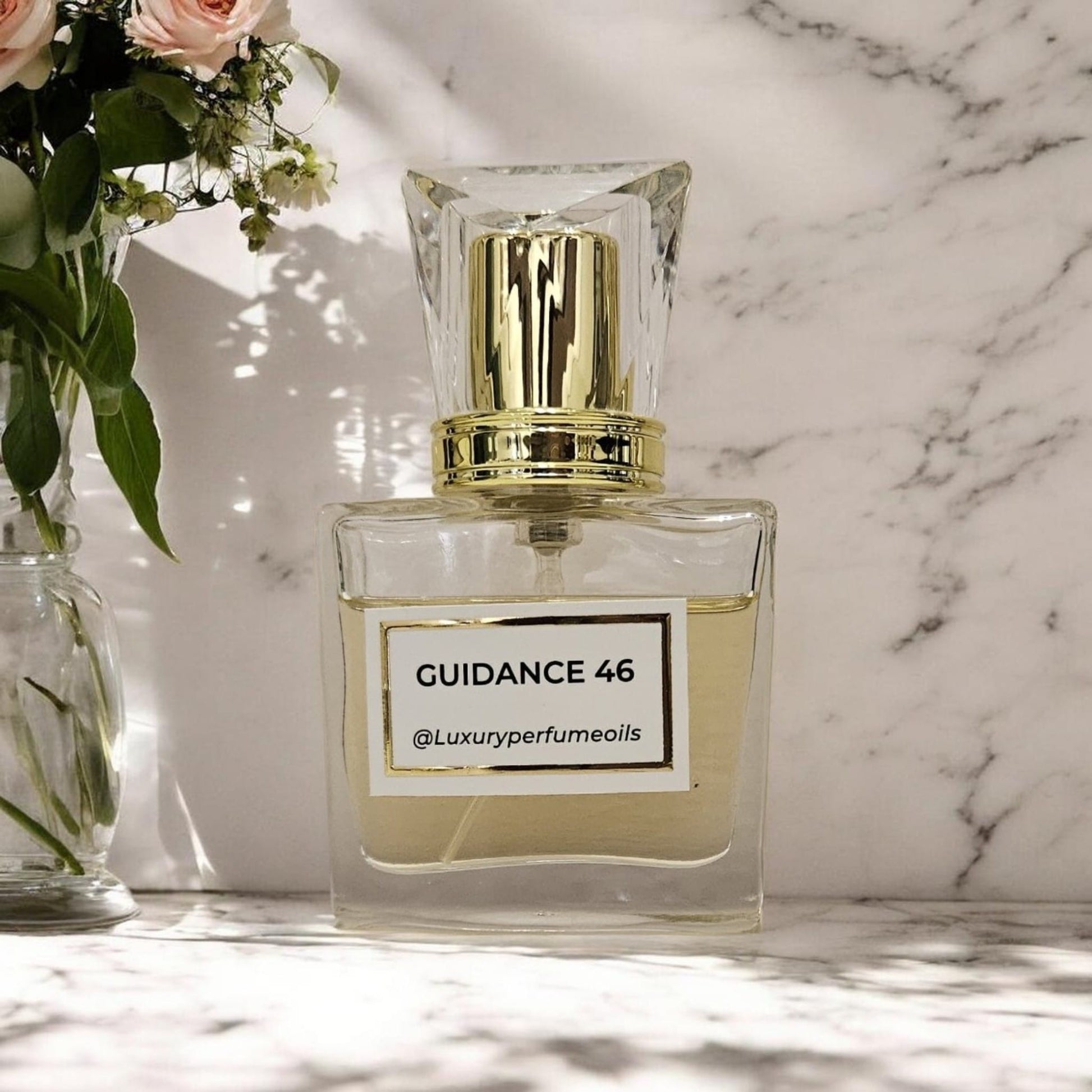Our Version of Guidance 46 20ml alcohol-free perfume oil bottle with floral fruity fragrance featuring pear, jasmine sambac, rose, vanilla, sandalwood, and ambergris.