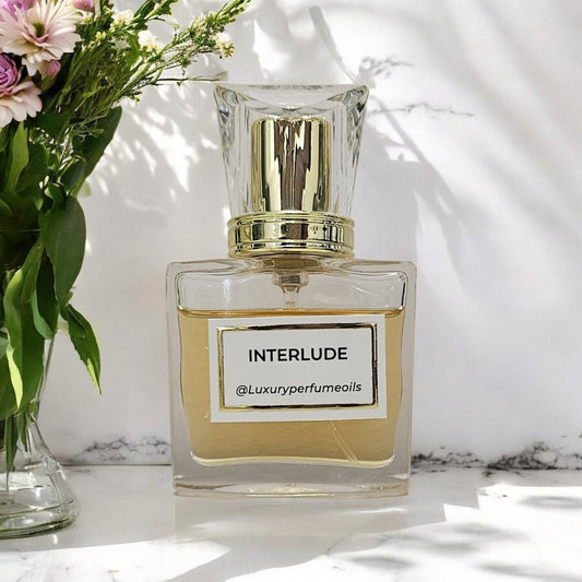 Our Version of Interlude 20ml alcohol-free perfume oil bottle with oriental woody fragrance featuring oud, leather, amber, sandalwood, and patchoulil alcohol-free perfume oil bottle with oriental woody fragrance featuring oud, leather, amber, sandalwood, and patchouli